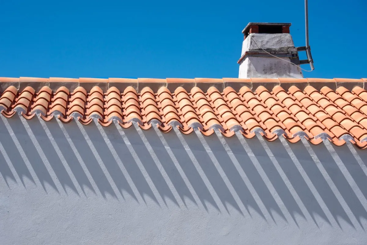 Roof ridge line and chimney on a home in Midland, TX